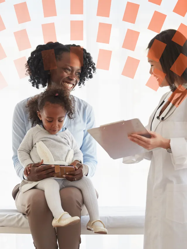 Doctor talking to a mother and child