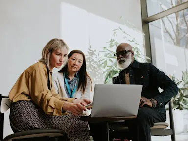 Three people coworking in modern office