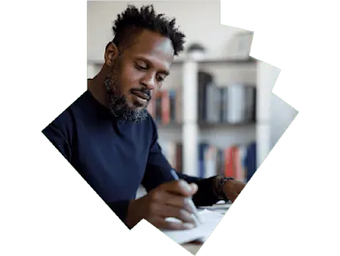 Man in sweater working at desk