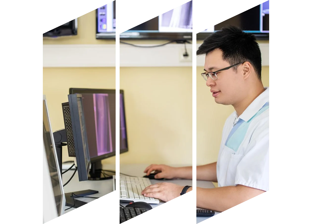 Group of radiologists looking at large screen