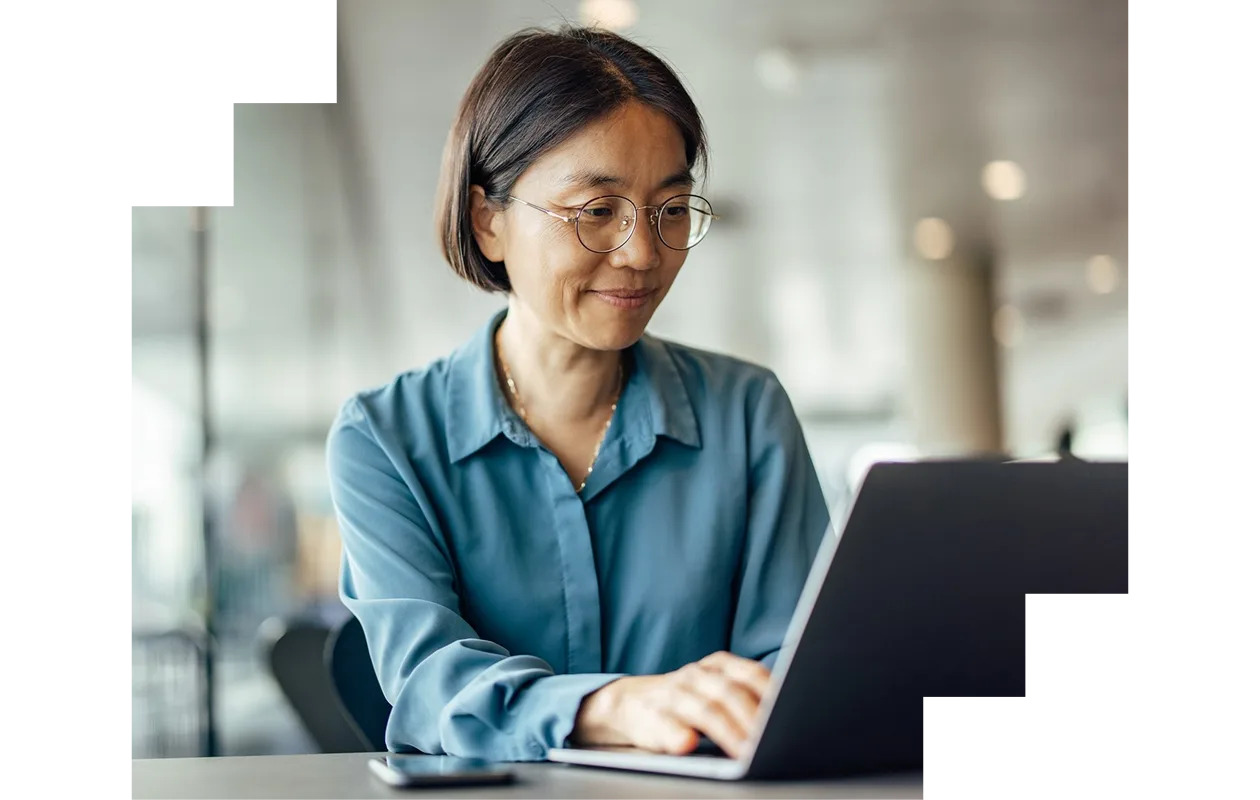 Woman working on her laptop at home