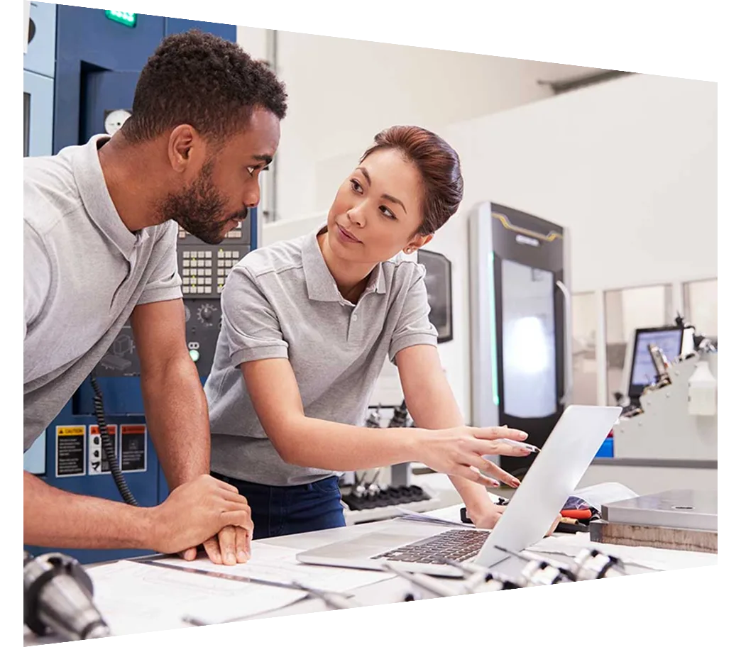 Two Engineers Using CAD Programming Software On Laptop