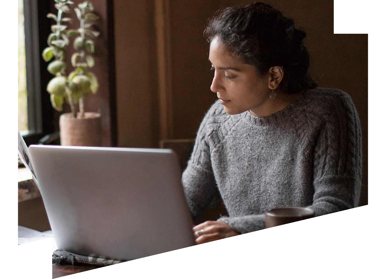 Young female working from home with laptop