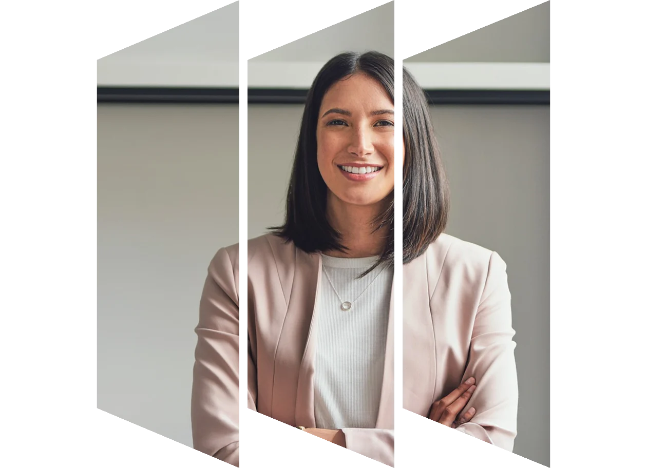 Confident business woman standing with arms folder