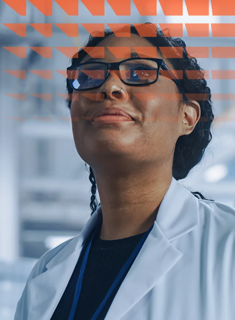 Female engineer looking around in wonder at an aerospace satellite manufacturing facility