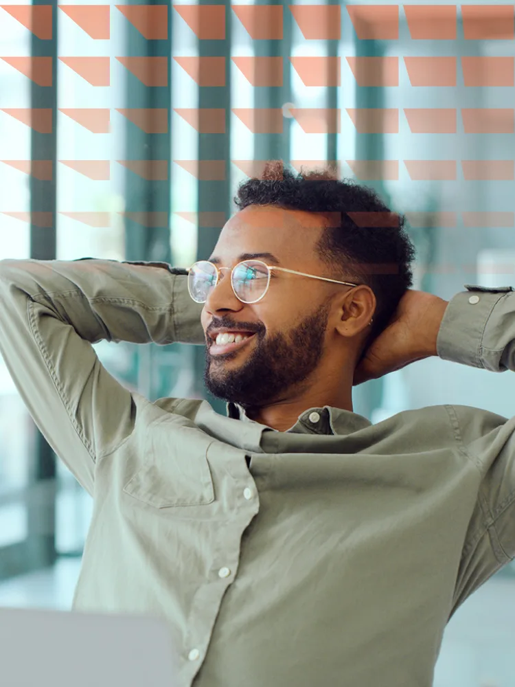 Shot of a young researcher taking a break at his desk