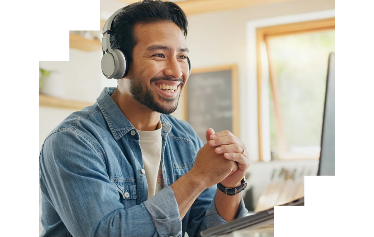 Male entrepreneur watching webinar on his laptop at home