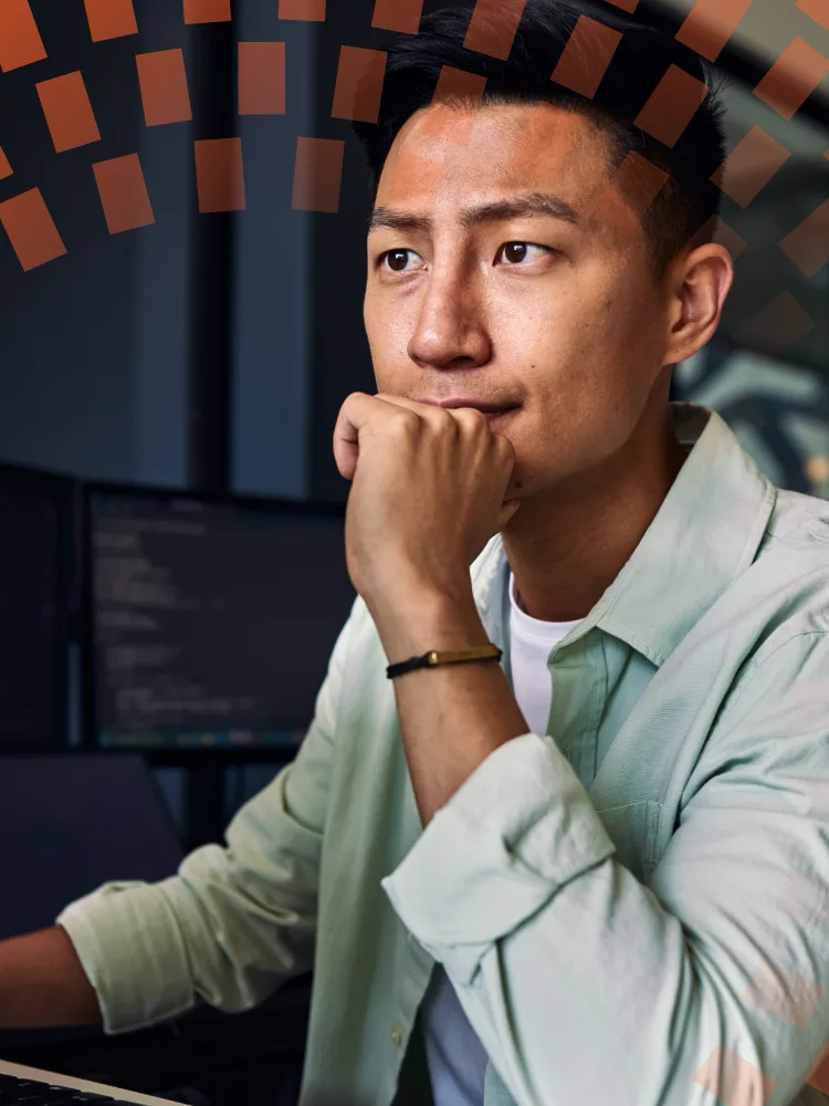 Young Asian man, looking intently at something out of frame