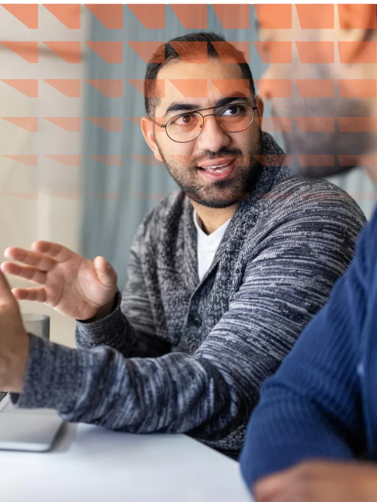 Two male software engineers working on a project