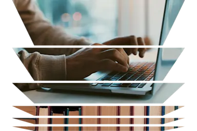 Up close image of hands typing on a laptop