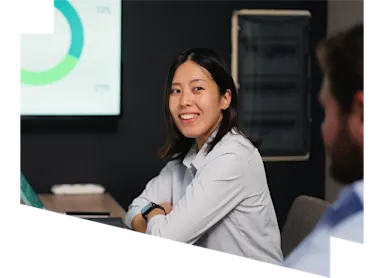 Woman presenting data to colleagues