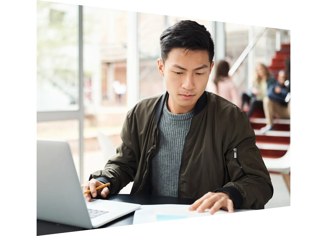 Student writing an exam at the university