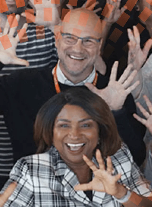 Office of Elsevier workers smiling at the camera