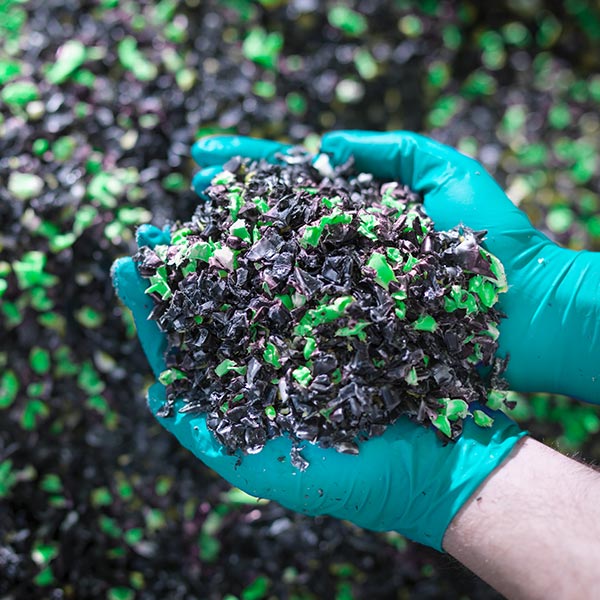 Adult holding manufacturing waste