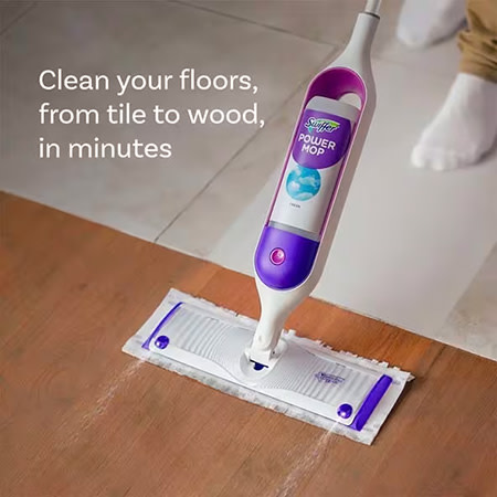 A white and purple Swiffer PowerMop glides across a floor.