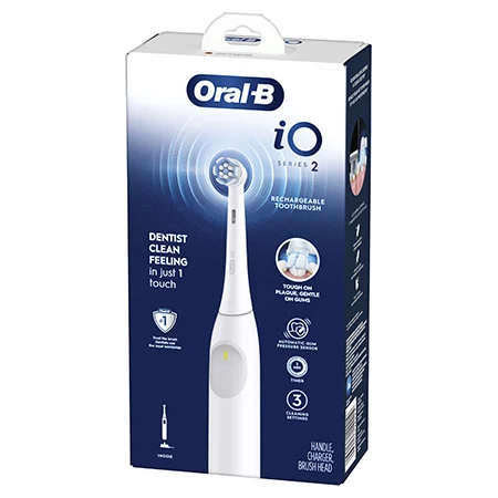 A boxed rechargeable electric toothbrush in rose gold displayed on retail packaging against a blue and white background with the words “Oral-B iO Series 2” on the front