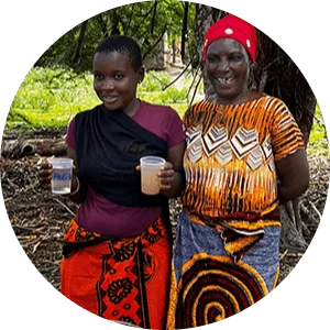 Two women holding glasses of purified water