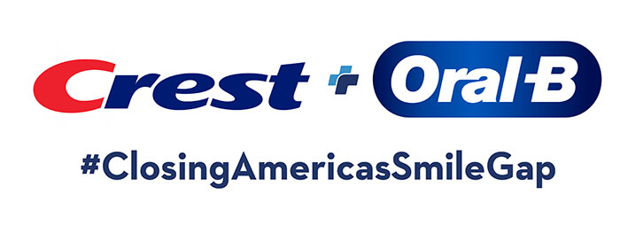 A red and dark blue typeface logo for Crest sits next to a typeface logo for Oral B, with white font and a blue background. The hashtag for the "Closing America's Smile Gap" campaign is placed beneath the logos.