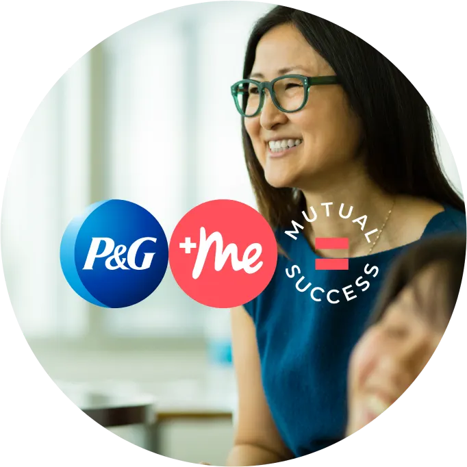 A woman with long black hair, green glasses, and a blue dress is smiling and looking left in a photo featuring graphics: the P&G logo, "Plus me" in a pink circle, and the words "mutual success" written in a circle with an equal sign in the middle.