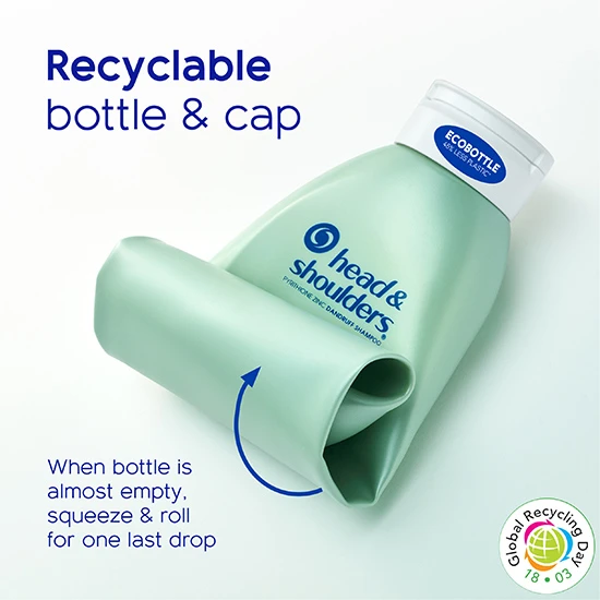 A mint green colored shampoo bottle features the blue font text logo for Head & Shoulders. Half of the bottle is rolled up on itself. And blue typeface says "Recyclable bottle & cap. When bottle is almost empty, squeeze and roll for one last drop."