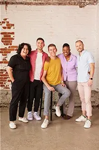 Five P&G employees smiling at the camera