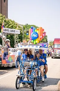 Two women on golf cart during Pride parade