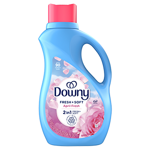 A blue bottle of liquid fabric softener with a pink cap, featuring a label with rose petals and a "Fresh + Soft" scent.