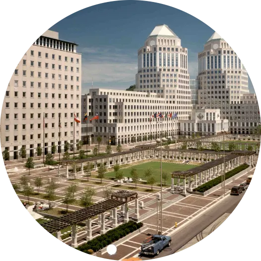 Historic building complex with gardens in front