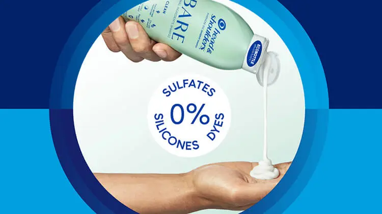 A hand squeezes a light green Head & Shoulders shampoo bottle while another hand catches the white liquid as it pours out of the spout. Blue text reads, "0% sulfates, silicones, dyes."