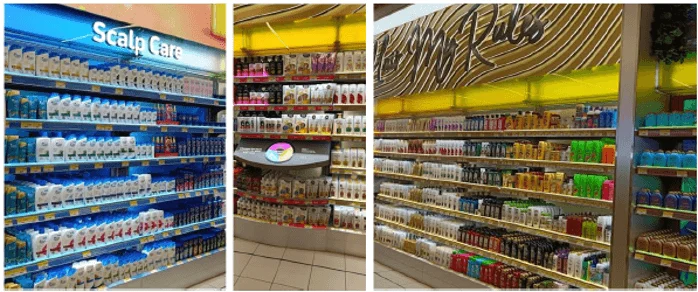 A variety of hair care products are displayed across three different store shelves. The shelves are in stores across the United Arab Emirates.