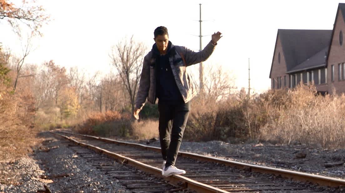 James walks on along the railroad tracks