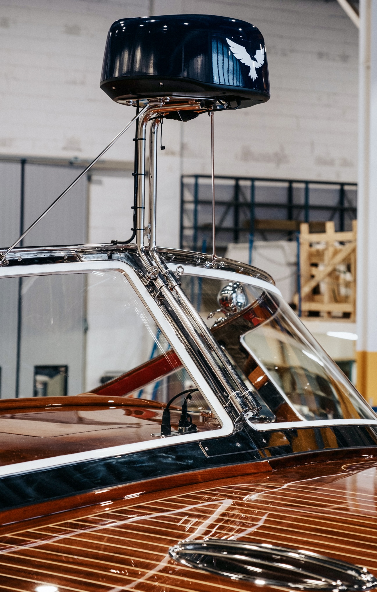 J Craft Torpedo radar dome housing with brand eagle logo, polished chrome support struts and varnished mahogany foredeck