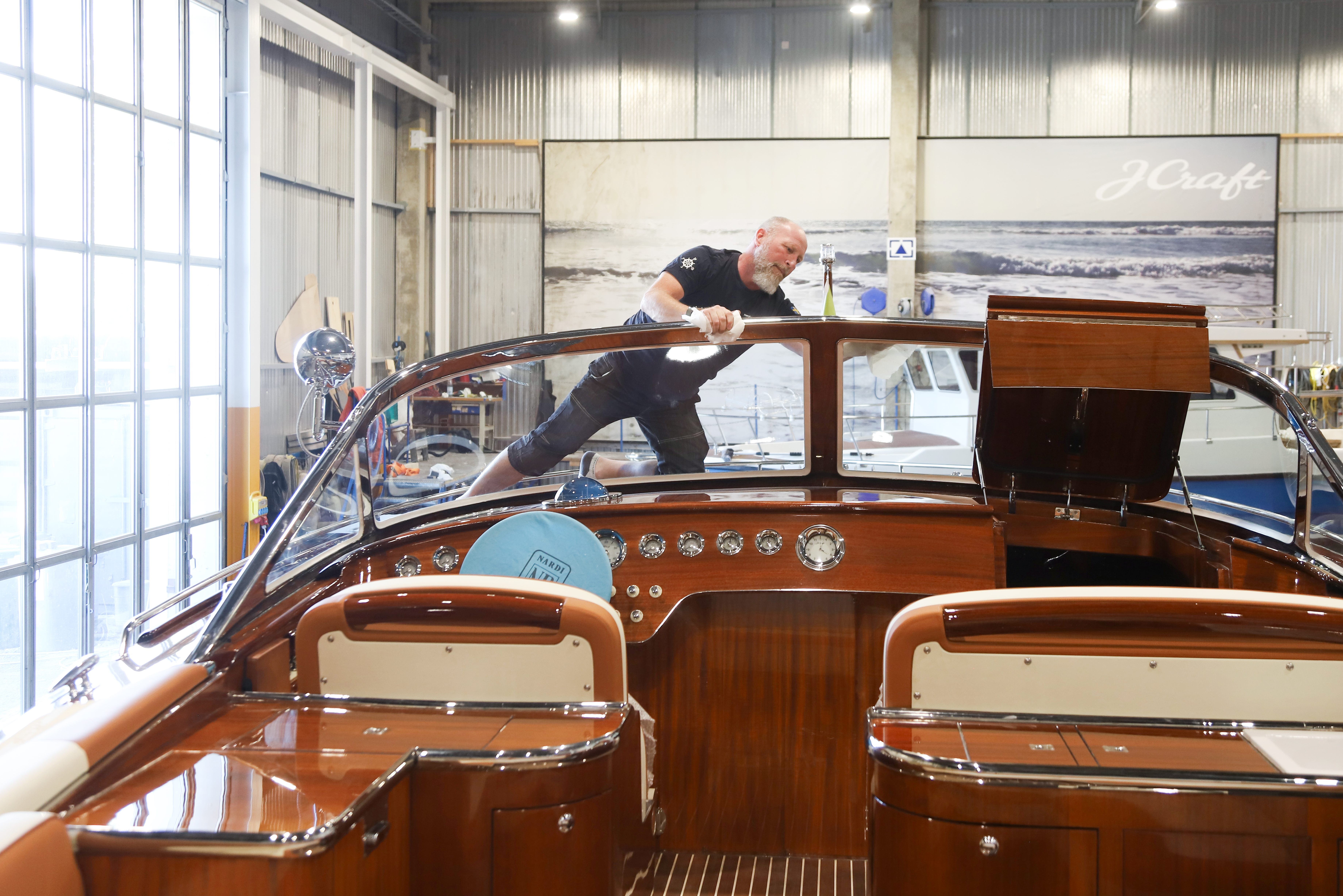 Mahogany above and teak below: the cockpit built, and its sole cured from raw and laid, all by hand.