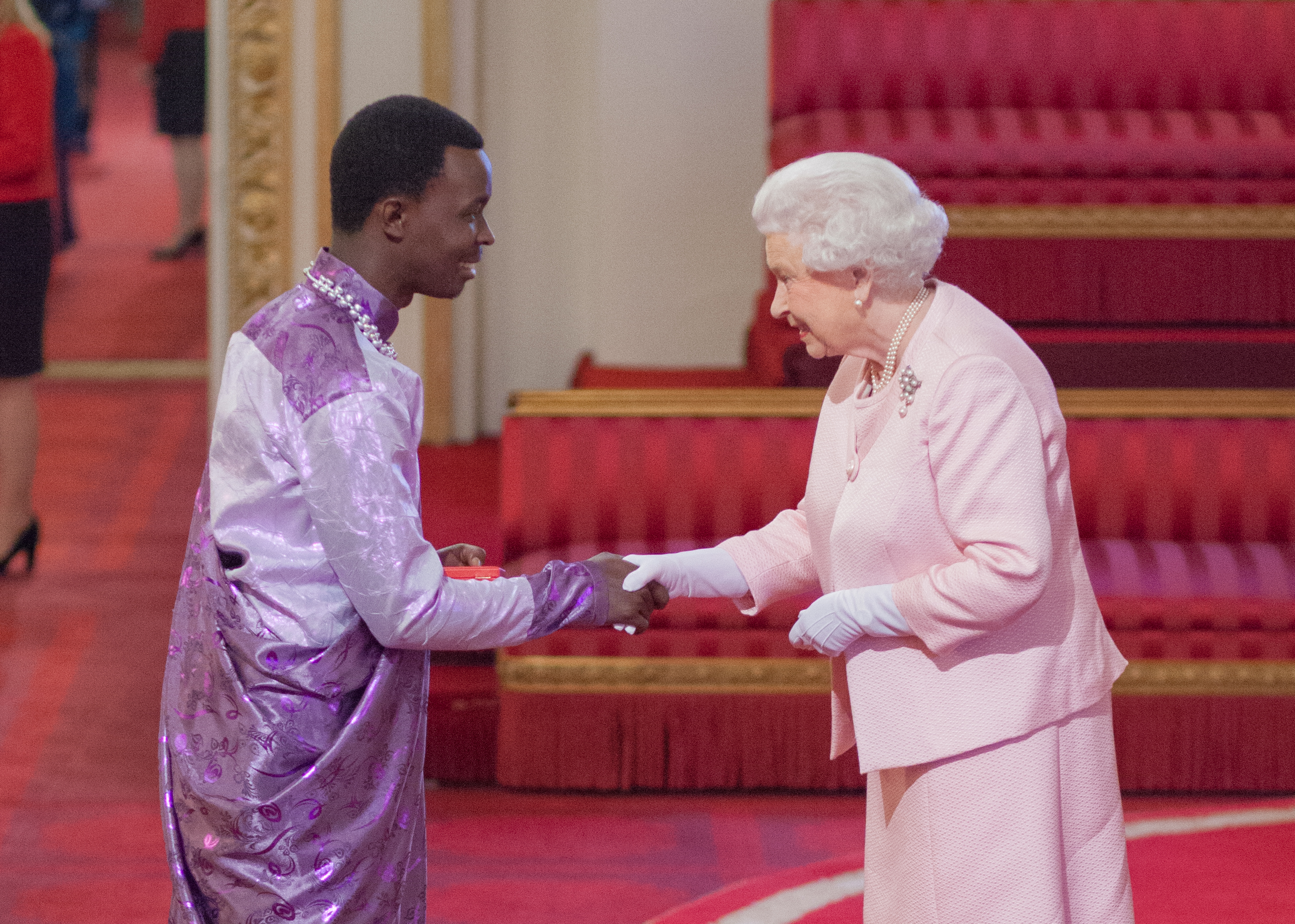 Jean d'Amour Mutoni with The Queen