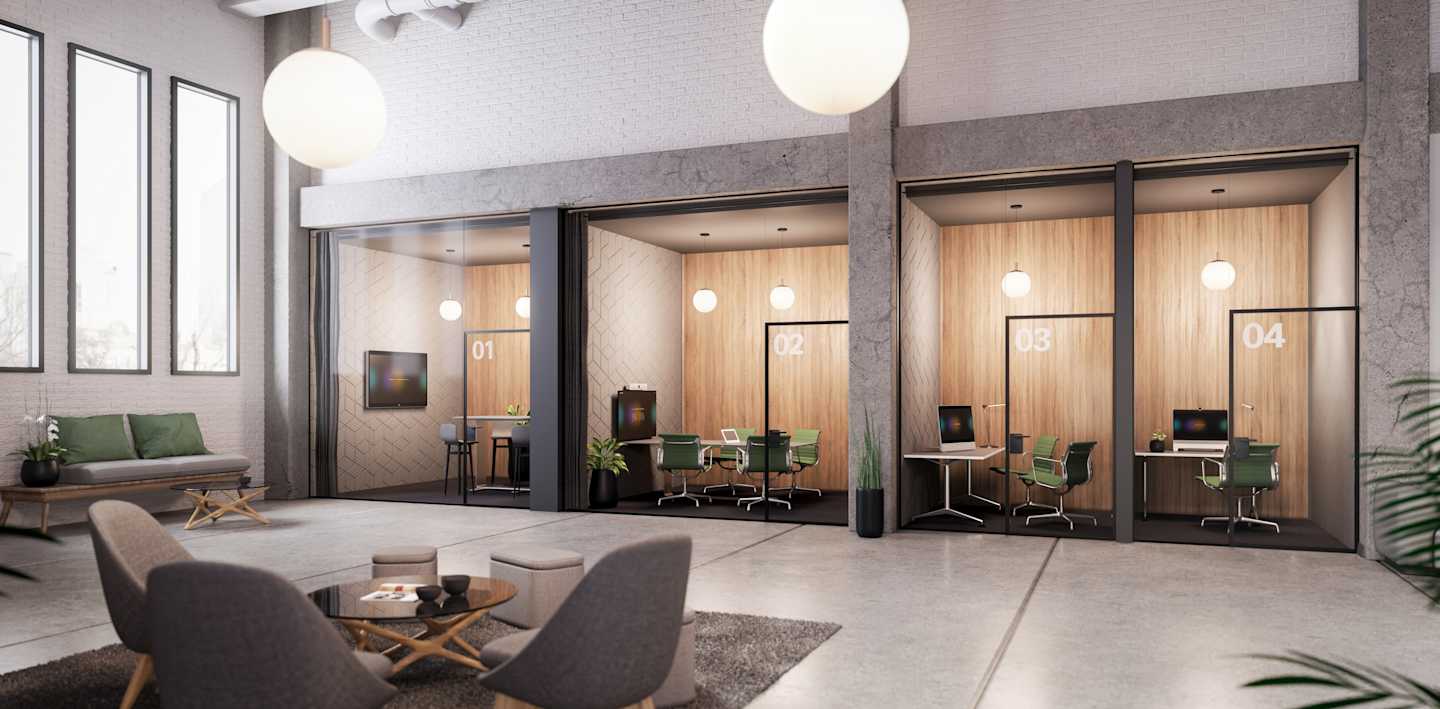 A welcoming modern office with four huddle spaces along the end wall featuring the Board Series, a Room Kit and two Desk Pro Webex devices.