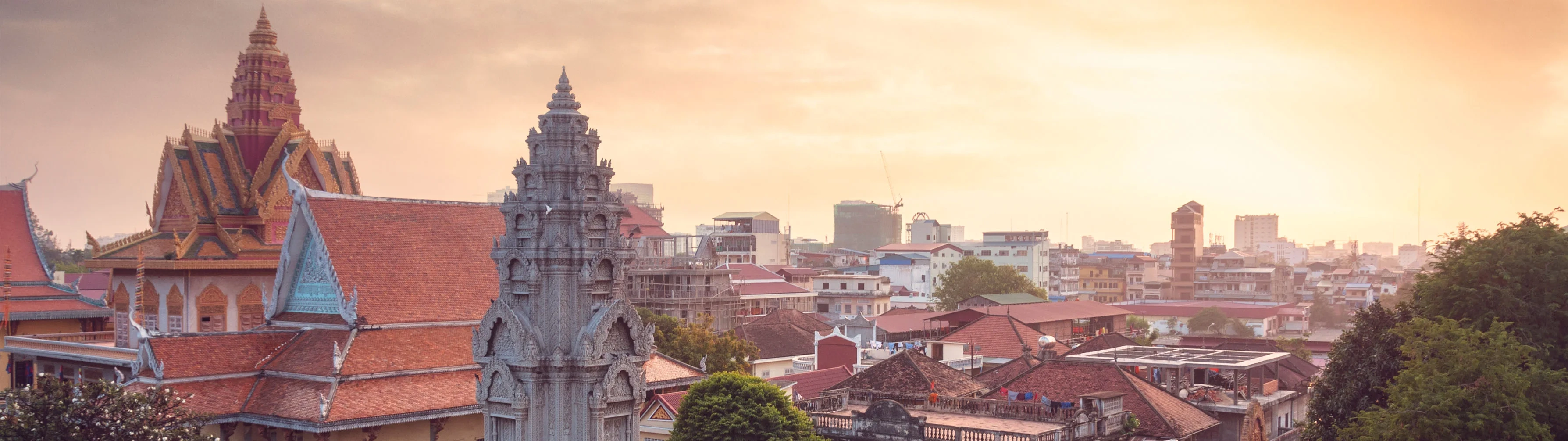 Sunrise over the rooftops of Phnom Penh, particularly the Royal Palace.