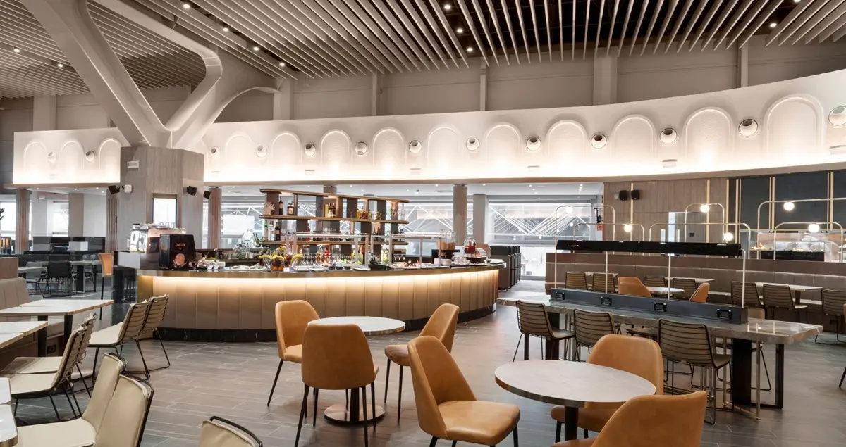 View of the bar and dining area of the Plaza Premium Lounge at Rome FCO airport.