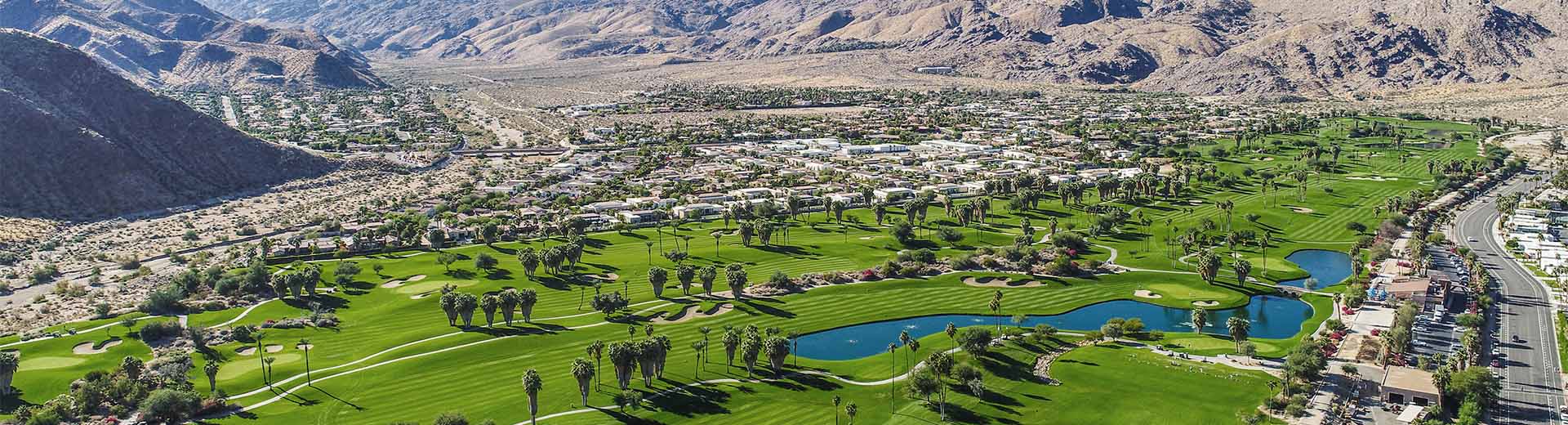 Srikingly green golf courses stand out against the faded browns of the desert that surrounds them.
