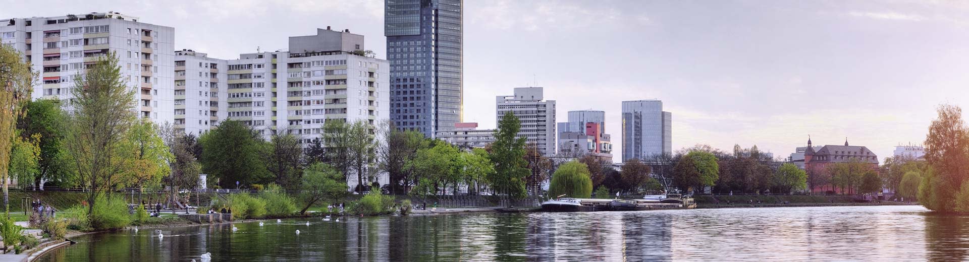 Along the waterfront, Offenbach's high-rise apartment buildings dominate the skyline.
