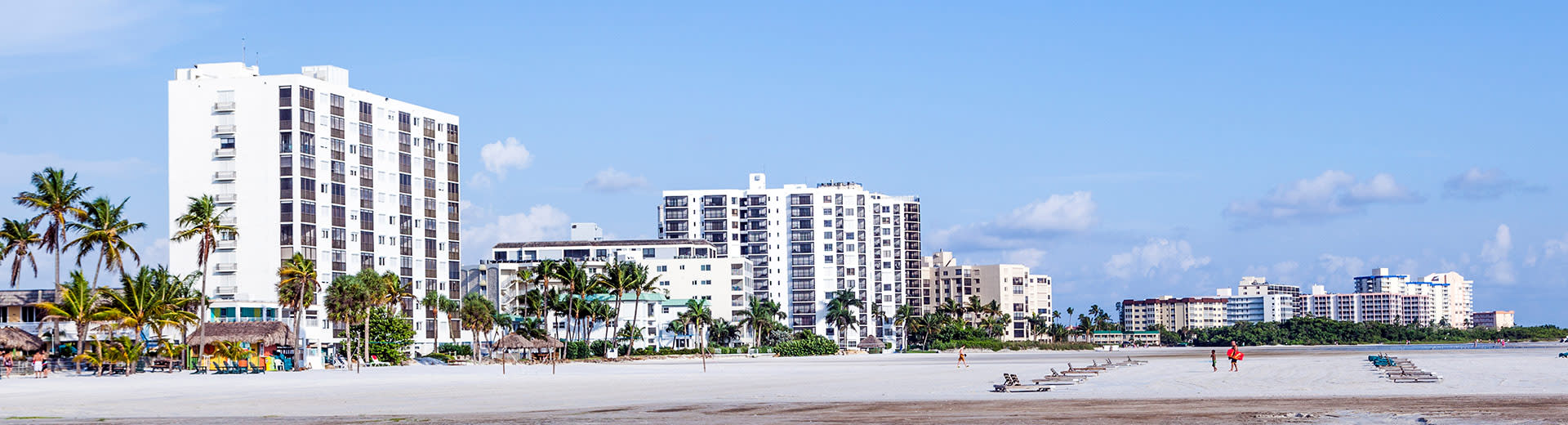 High rise hotels overlook a beach in Fort Myers on a beautiful summer's day.