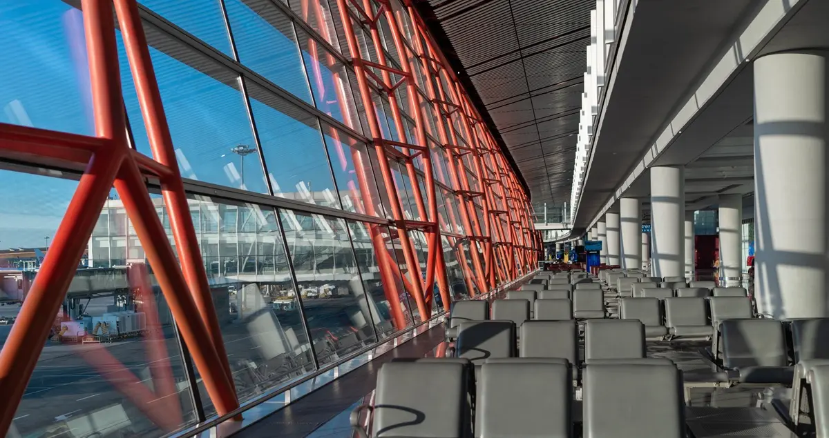 Shot of a departure lounge in Beijing PEK Airport, with the sun shining through the window.