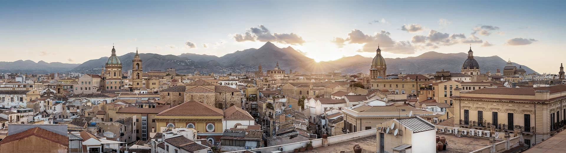 Sunny Palermo stretches far, with a combination of new and very old buildings.