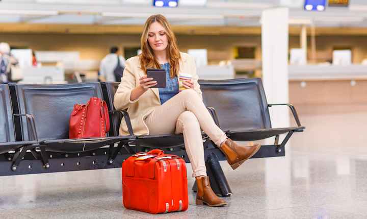Person sitting in airport waiting area
