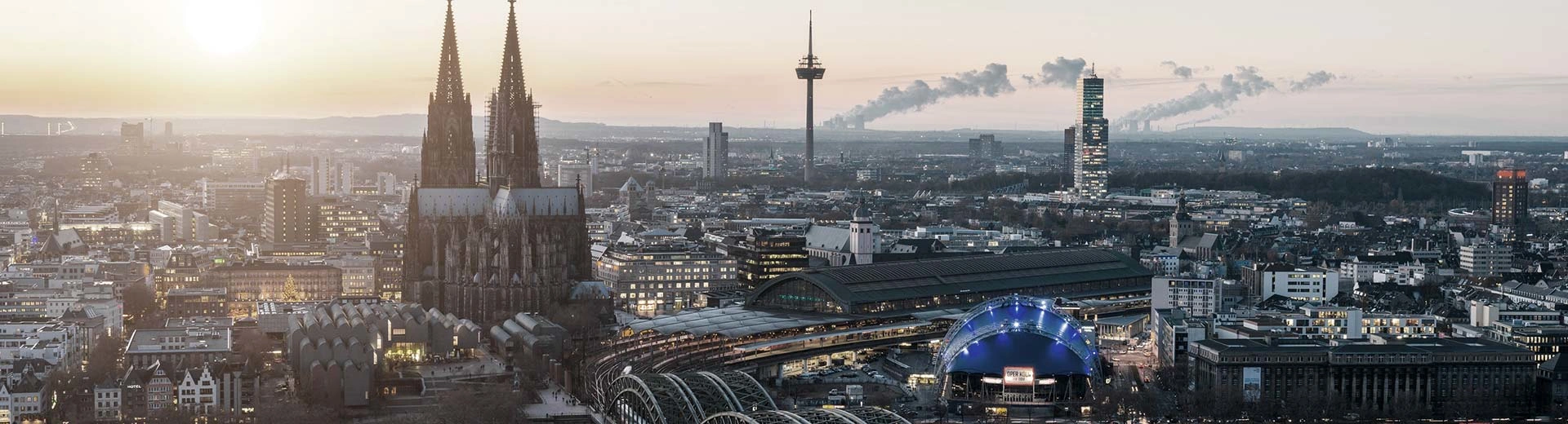 The beautiful skyline of Cologne at sunset, complete with the famous cathedral.