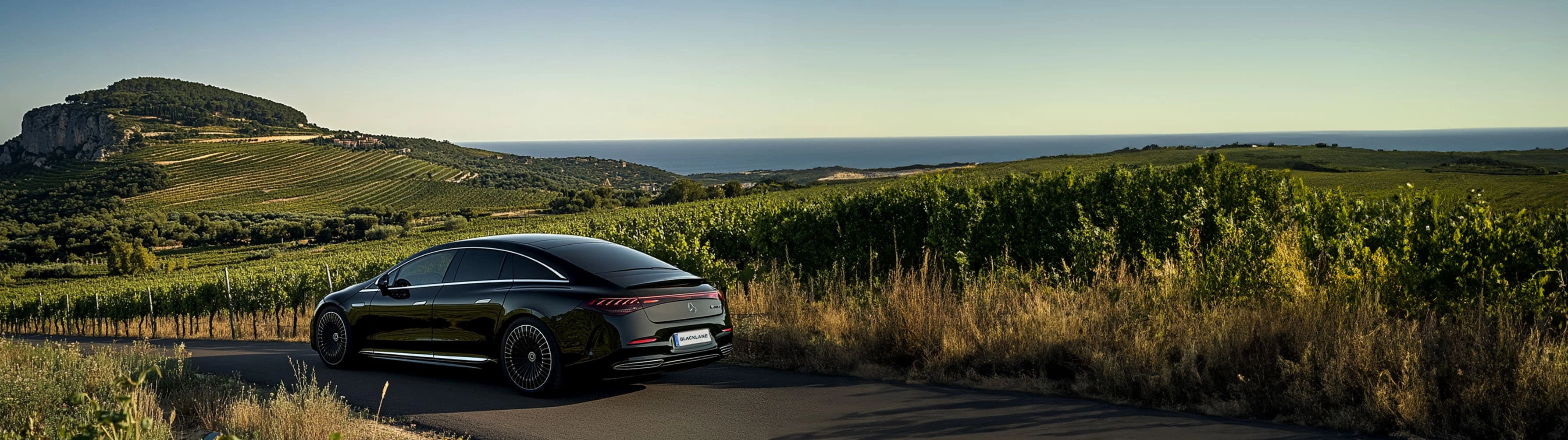 A Blacklane Mercedes limo travels past vineyards from Marseille to Châteauneuf-du-Pape.
