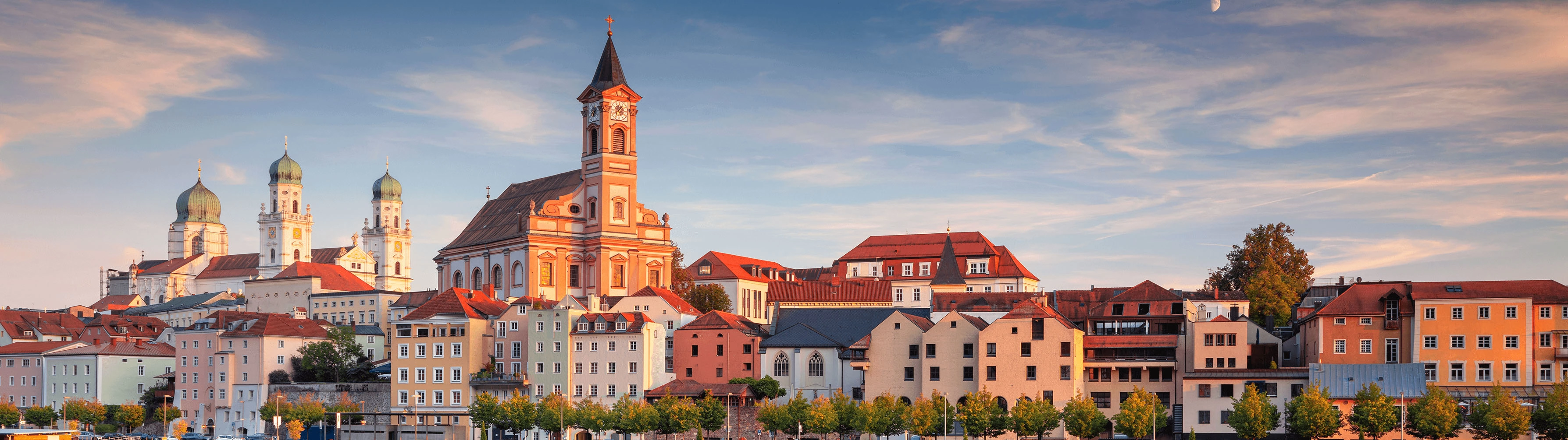 Beautiful old buildings in Passau on a clear evening.