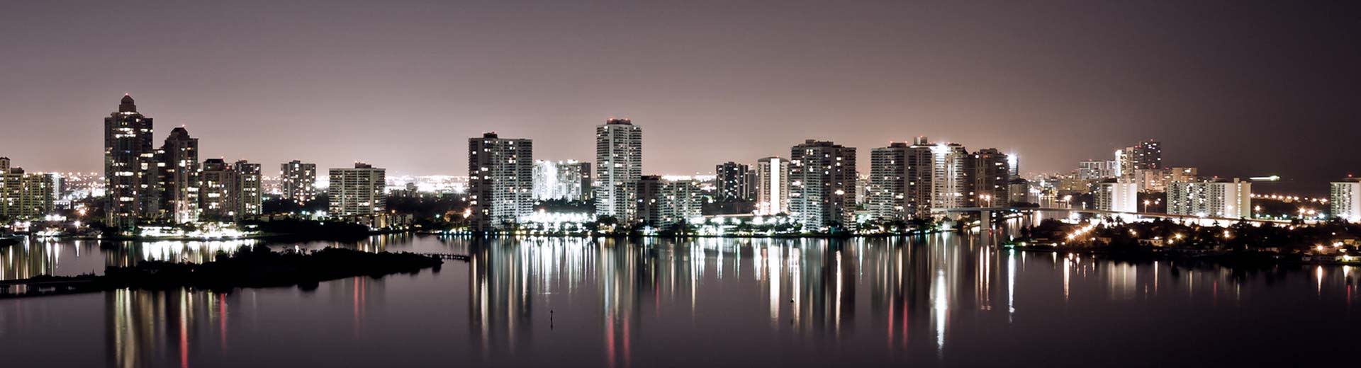 At nighttime the skyline of Fort Lauderdale lights up the sky.