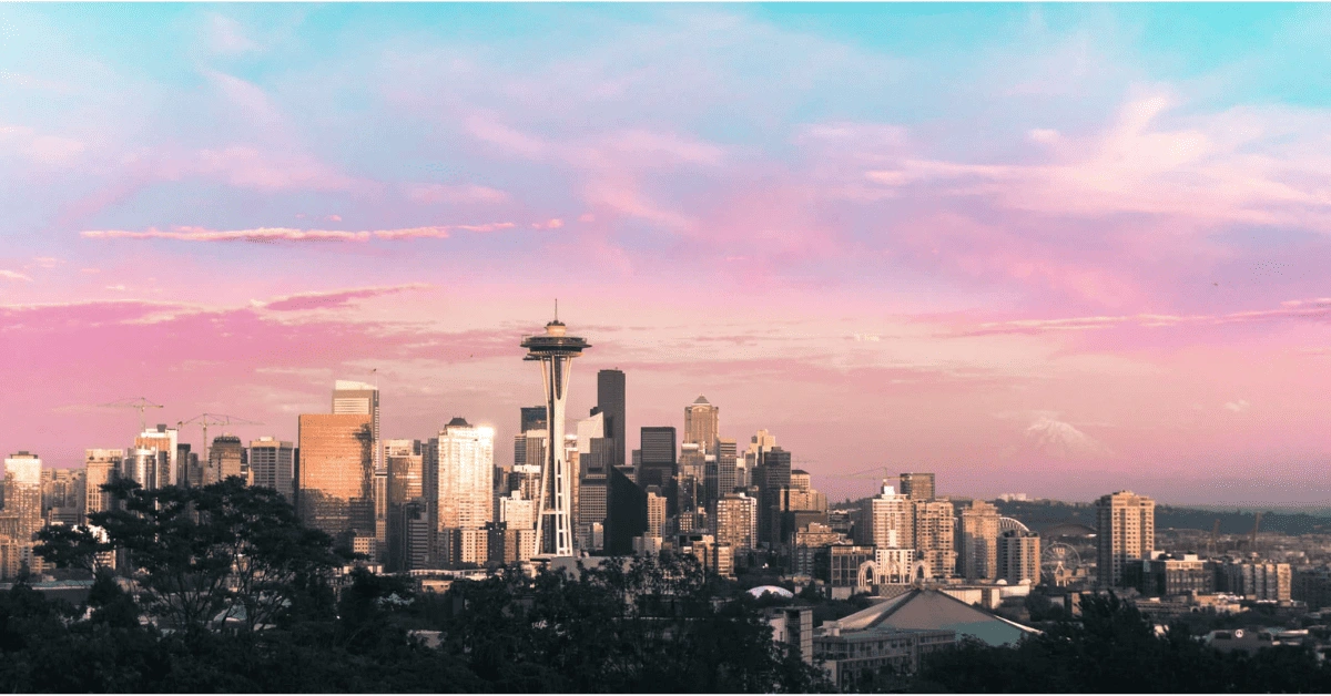 <figcaption class="wp-element-caption">Seattle skyline at sunset. <em>Image credit: Ben Dutton/Unsplash </em></figcaption>