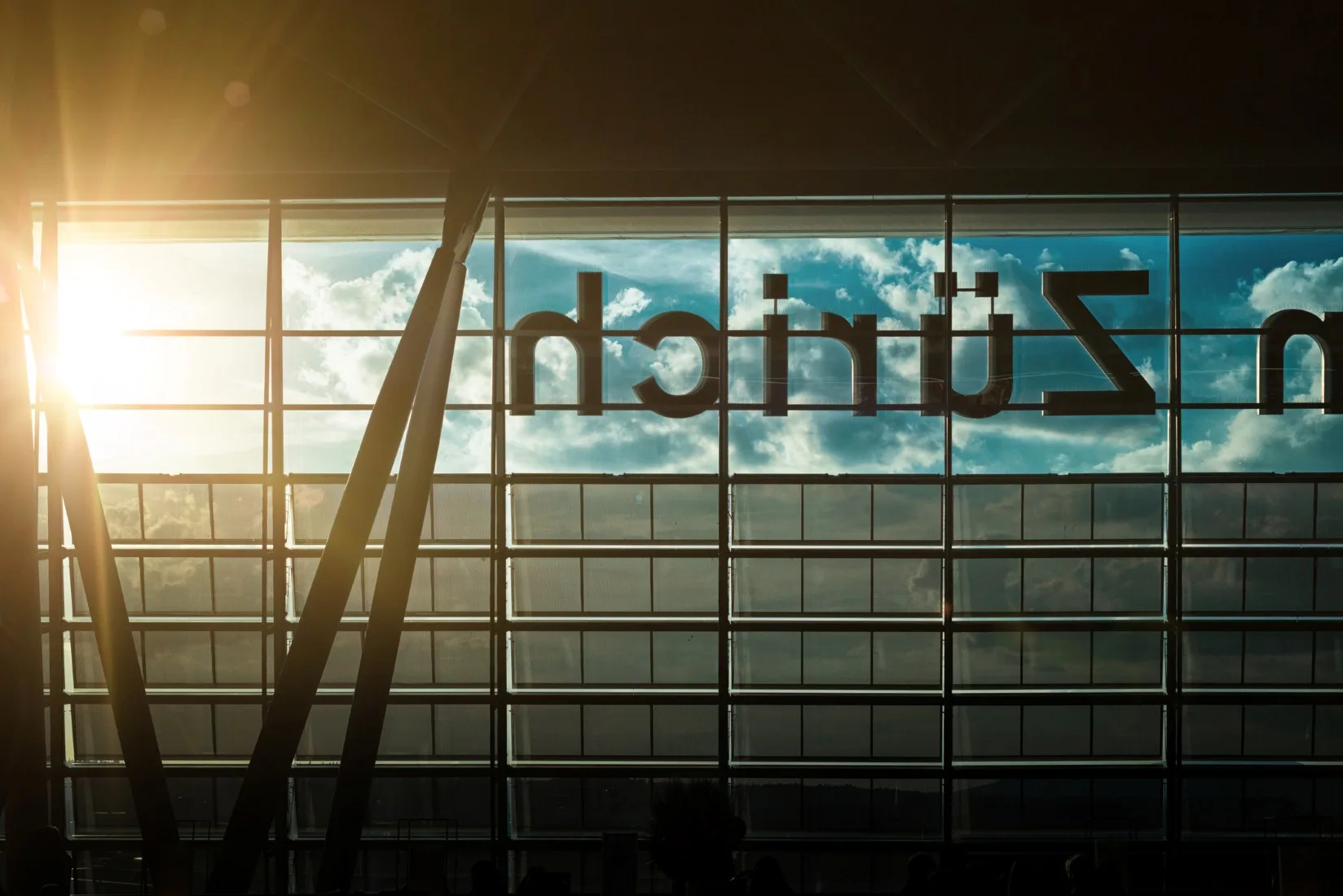 Zurich airport sign with sun shining through the window.