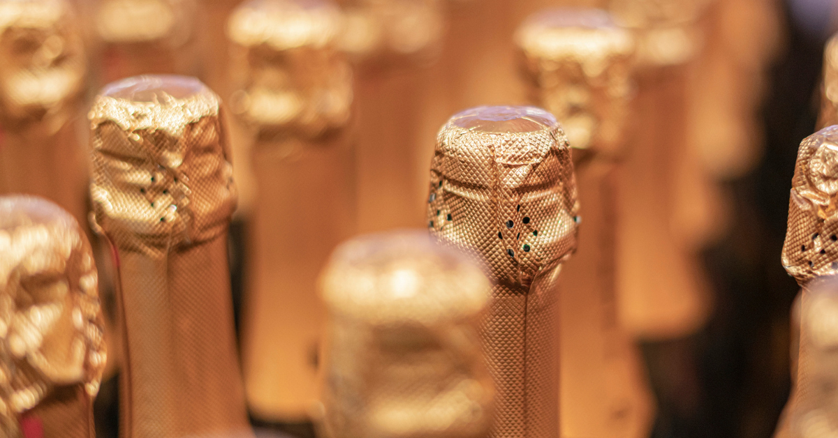 Rows of unopened champagne bottles
